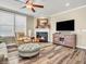 Inviting living room showcasing a fireplace, TV, and comfortable seating at 4993 Silverbell Dr, Plainfield, IN 46168