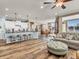 Spacious living room blending seamlessly into a kitchen and dining area at 4993 Silverbell Dr, Plainfield, IN 46168