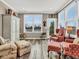 Bright sitting room with comfortable seating, natural light, and view of lake at 4993 Silverbell Dr, Plainfield, IN 46168