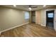 Bedroom featuring closet with louvered doors, vinyl floors, and natural light at 5105 Manning Rd, Indianapolis, IN 46228
