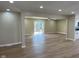 Spacious living room with new flooring and a sliding door leading to a deck at 5105 Manning Rd, Indianapolis, IN 46228
