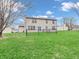 Spacious backyard featuring a lush green lawn and a secure black chain-link fence at 5524 Cherry Blossom Ct, Indianapolis, IN 46237