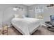 Bedroom featuring a large window, neutral carpet, and a gray chair at 5524 Cherry Blossom Ct, Indianapolis, IN 46237