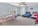 Bedroom featuring a large window, a closet, neutral carpet and two beds at 5524 Cherry Blossom Ct, Indianapolis, IN 46237