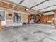 Spacious and organized garage with ample storage, bicycles, and easy access to the outdoors at 5524 Cherry Blossom Ct, Indianapolis, IN 46237