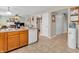 Functional kitchen with tile flooring and view to adjacent rooms and staircase at 5524 Cherry Blossom Ct, Indianapolis, IN 46237
