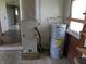 The utility room features a furnace and water heater, essential systems for a comfortable home environment at 5961 N 200 W, Columbus, IN 47201