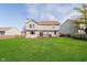 Spacious backyard features a well-maintained lawn, a cozy deck, and great landscaping at 6134 Chadsworth Way, Lawrence, IN 46236
