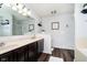 Bathroom features a large mirror, double vanity, and tile flooring at 6134 Chadsworth Way, Lawrence, IN 46236
