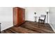 Bedroom features wood floors and is decorated with a lamp, desk, and a small table at 6134 Chadsworth Way, Lawrence, IN 46236