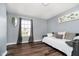 Bedroom with daybed features wood floors and a window to provide natural light at 6134 Chadsworth Way, Lawrence, IN 46236