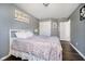 Bedroom with a bed, wood floors, and a closet for storage at 6134 Chadsworth Way, Lawrence, IN 46236