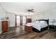 Spacious main bedroom features a ceiling fan and windows that provide natural light at 6134 Chadsworth Way, Lawrence, IN 46236