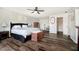 Spacious main bedroom features a ceiling fan and an ensuite bath with a walk-in closet at 6134 Chadsworth Way, Lawrence, IN 46236
