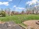 Large grassy backyard with a playset providing ample space for recreation and relaxation at 6347 St Joe Dr, Indianapolis, IN 46217