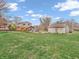 Lush backyard featuring a garage and patio creating a private outdoor living space at 6347 St Joe Dr, Indianapolis, IN 46217