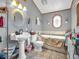 Cozy bathroom featuring an oval mirror, pedestal sink, and a tub with shower at 6347 St Joe Dr, Indianapolis, IN 46217