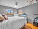 Bright bedroom with light grey walls, hardwood floors, dresser and aquarium at 6347 St Joe Dr, Indianapolis, IN 46217