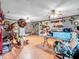Large bonus room featuring tile flooring, drop ceiling and ample storage shelving at 6347 St Joe Dr, Indianapolis, IN 46217