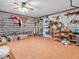 Large bonus room with tile flooring featuring built in storage shelving and lots of space at 6347 St Joe Dr, Indianapolis, IN 46217