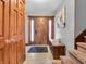 Welcoming foyer featuring a beautifully crafted wooden door, neutral decor, and a staircase at 6347 St Joe Dr, Indianapolis, IN 46217
