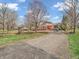 Charming two-story brick home featuring a bright red door and well-maintained front yard at 6347 St Joe Dr, Indianapolis, IN 46217
