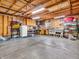 The garage interior is well organized, with wooden shelving and plenty of room for storage at 6347 St Joe Dr, Indianapolis, IN 46217