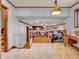 A landing area with wooden flooring overlooking the living room and fireplace at 6347 St Joe Dr, Indianapolis, IN 46217
