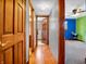 Hallway with wood flooring and views of bedrooms and bathroom at 6347 St Joe Dr, Indianapolis, IN 46217