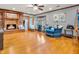 Inviting living room with a brick fireplace, wood floors, and large windows for natural light at 6347 St Joe Dr, Indianapolis, IN 46217