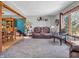 Cozy living room features neutral walls, plush carpeting, and access to the dining area at 6347 St Joe Dr, Indianapolis, IN 46217