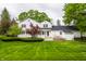 Picture of the home's backyard with lush lawn and landscaping at 650 Forest Blvd, Indianapolis, IN 46240