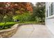 Backyard patio with beautiful landscaping and stone retaining wall at 650 Forest Blvd, Indianapolis, IN 46240