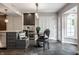 Charming dining area featuring a built-in bench, wine cooler, and access to the backyard at 650 Forest Blvd, Indianapolis, IN 46240