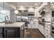 Gourmet kitchen featuring a large stainless steel refrigerator and modern white cabinetry at 650 Forest Blvd, Indianapolis, IN 46240