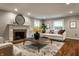 Bright living room features a fireplace, contemporary decor, and hardwood floors at 650 Forest Blvd, Indianapolis, IN 46240
