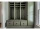 Custom mudroom with built-in storage cabinets, drawers, bench and coat hooks at 650 Forest Blvd, Indianapolis, IN 46240