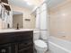 Bathroom featuring a vanity with a dark wood cabinet, a toilet, and a bathtub-shower combo at 652 Blossom Dr, Avon, IN 46123