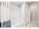 Full bath with shower and tub featuring a modern shower head and sliding doors at 652 Blossom Dr, Avon, IN 46123