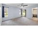 Spacious bedroom with neutral carpet, ceiling fan, and sliding glass door to a patio at 652 Blossom Dr, Avon, IN 46123