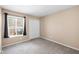 Bedroom featuring neutral walls, carpet, a window and a double door closet at 652 Blossom Dr, Avon, IN 46123