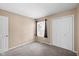 Cozy bedroom with neutral walls, a window with dark curtains and a double door closet at 652 Blossom Dr, Avon, IN 46123