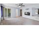 View of bedroom with carpet, fireplace, sliding door, and views to the outside at 652 Blossom Dr, Avon, IN 46123