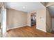 Bright dining area showcasing hardwood floors, access to the kitchen, and great natural light from a sliding glass door at 652 Blossom Dr, Avon, IN 46123