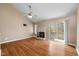 Spacious living room featuring a fireplace, vaulted ceilings, hardwood floors, and a sliding glass door to a balcony at 652 Blossom Dr, Avon, IN 46123