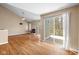 Open concept living room featuring hardwood floors, a fireplace, and a walkout to a balcony, perfect for entertaining at 652 Blossom Dr, Avon, IN 46123