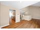 Spacious living area with hardwood floors and an open view into the kitchen and second level at 652 Blossom Dr, Avon, IN 46123
