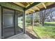 Covered patio with sliding glass door and large grassy area at 652 Blossom Dr, Avon, IN 46123
