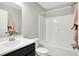 Bathroom with modern vanity, a shower and bathtub combination, and neutral walls at 7111 Lillian Pl, Cumberland, IN 46229