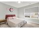 Bedroom with a full sized bed, large window, neutral carpet and walls at 7111 Lillian Pl, Cumberland, IN 46229